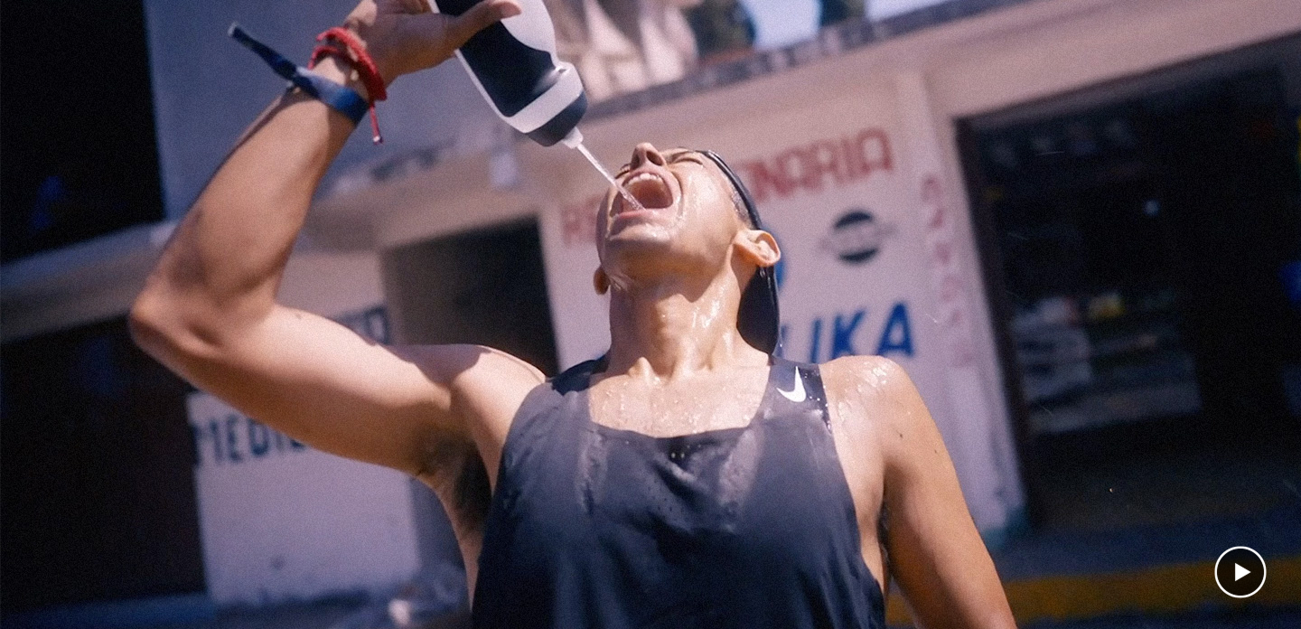 Chris standing up holding his daughter Elva